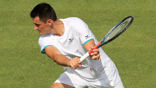 'Unwell': Bernard Tomic's Wimbledon campaign took less than an hour to fizzle out in a straight-sets loss to Jo-Wilfried Tsonga.