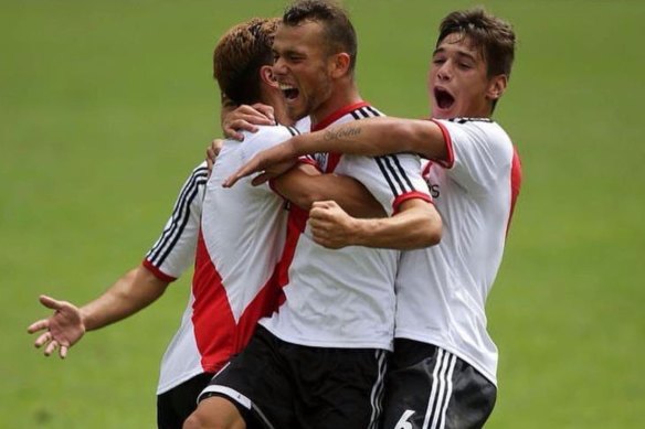 Gavin De Niese celebrates his winning goal for River Plate against Boca Juniors with Gonzalo Montiel (left, obscured) and Lucas Martinez Quarta.