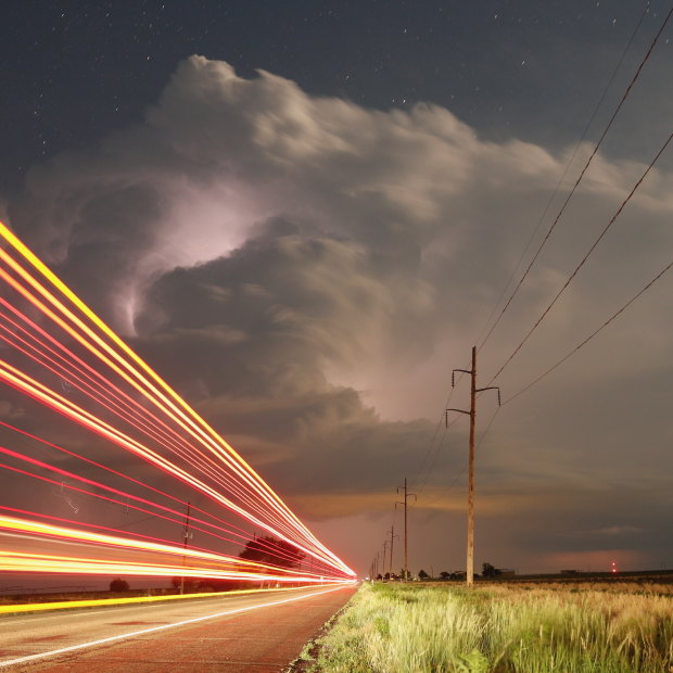 Truck lights blast past as storms continue in Texas and Oklahoma.