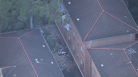 The wall of the Lidcombe apartment complex blew out, leaving a hole in the side of the building.