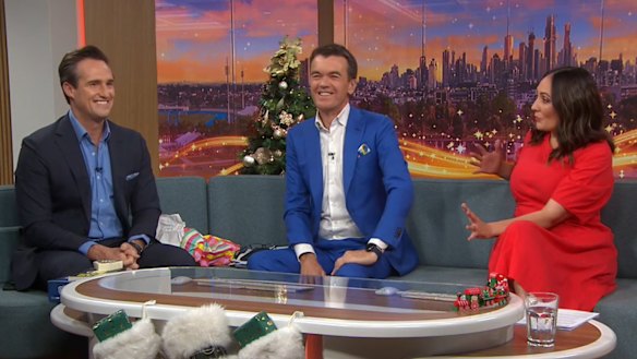 Michael Rowland (centre) announces James Glenday (left) will replace him as co-host of News Breakfast, with Bridget Brennan.