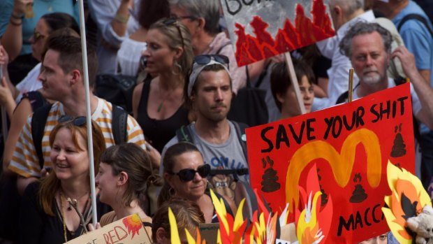 Thousands of protesters rally in front of Sydney Town Hall calling for action on climate change.
