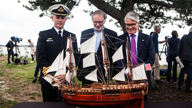 Australian Navy Commander Doug Theobold, Australian National Maritime Museum chair Peter Dexter and Australia's Consul-General to New York with a replica of the Endeavour