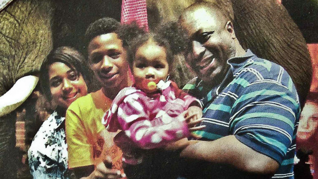 Eric Garner (right), pictured with his family, said 'I can't breathe' 11 times before he died. 