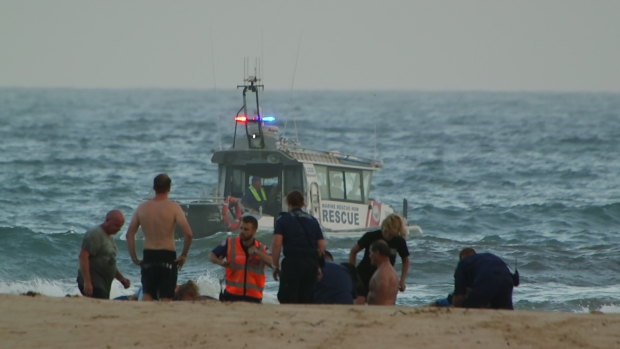 Rescuers tried to save three men after they got into trouble in the water.