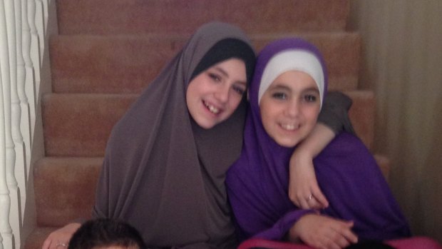 Hoda Sharrouf (right) has begged to be allowed back into Australia. She is pictured with sister Zaynab before leaving the country. 