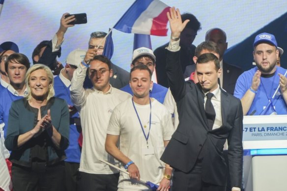 Marine Le Pen, leader of National Rally, and party president Jordan Bardella at a European Parliament election campaign rally. 