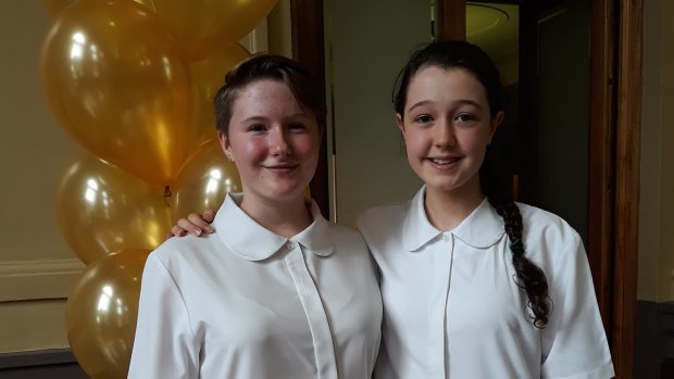 Woden Valley Youth Choir members Evangeline Osborne, 13, and Hannah Harper, 15, at the Canberra Gold Awards ceremony where the choir was recognised for 50 years of service to the national capital.