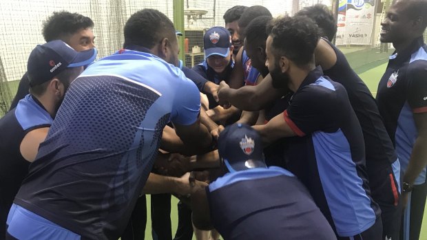 Steve Smith (pictured centre with head down) training with his Toronto Nationals teammates ahead of the T20 Canada competition.