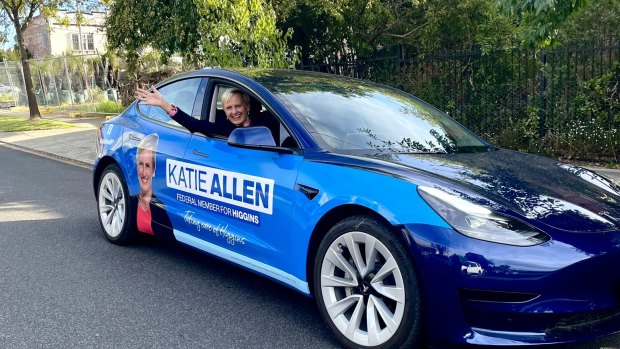 Katie Allen in her Tesla, specially branded for the campaign.