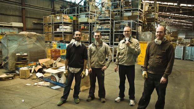 Warren Taylor, far right, Jon Campbell, second from right, and others at Michael Isaachsen's other warehouse in Brooklyn.