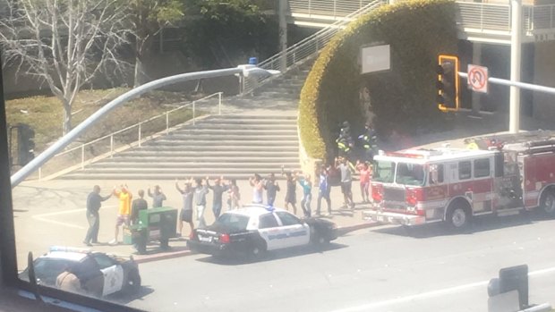 Employees evacuate the YouTube headquarters in San Bruno, California after reports of an active shooter.