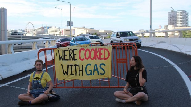 Extinction Rebellion protesters block the Turbot Street off-ramp on the Riverside Expressway in Brisbane City on Wednesday morning. 