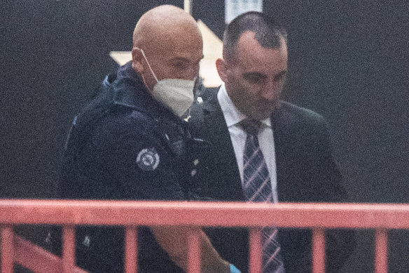 Jason Roberts leaves the Supreme Court on the first day of his murder trial. Roberts, 41, has pleaded not guilty to two charges of murder over the deaths of Sergeant Gary Silk and Senior Constable Rodney Miller in August 1998.