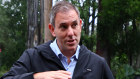 Jim Chalmers talks weather with army personnel.