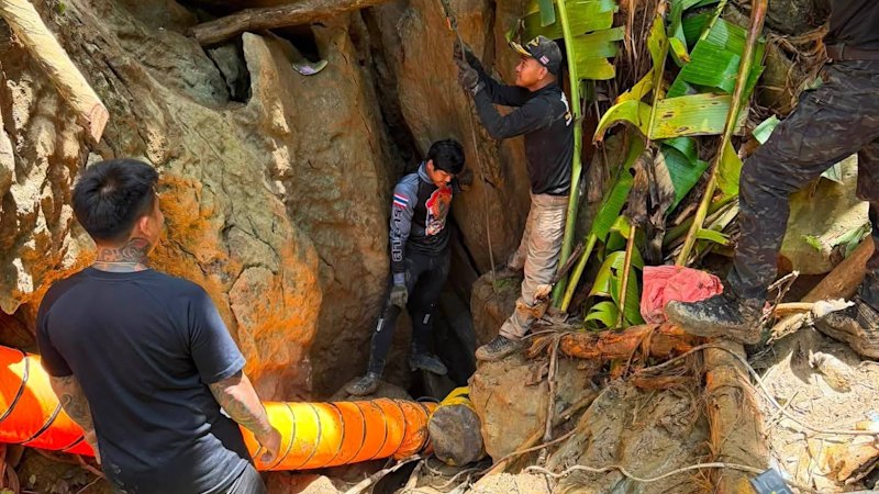 ‘It’s so narrow’: Rescuers race to find seven trapped in flooded Laos cave for a week