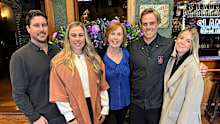 Joy Moore (centre) pictured with her children Tom and Sam and their partners.