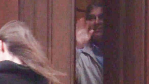 Prince Andrew peers out from behind the door of convicted sex offender Jeffrey Epstein’s Manhattan mansion in 2010 in a video published by the Mail on Sunday in 2019.