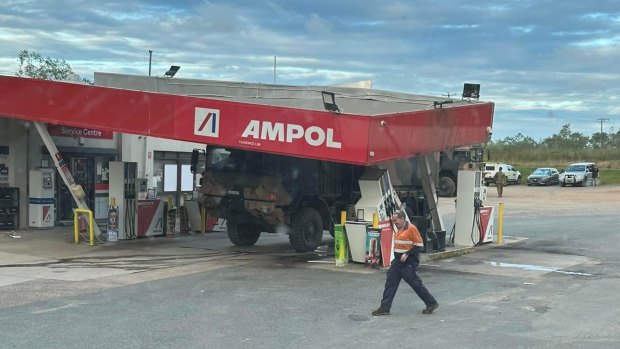 Oops … the army truck has severely damaged the petrol station.