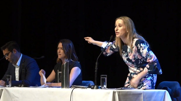 Liberal candidate Kate Ashmor makes her point as Labor's Josh Burns takes notes. 