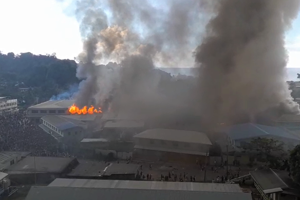 Buildings burn in Honiara’s Chinatown, in the Solomon Islands on Thursday. 