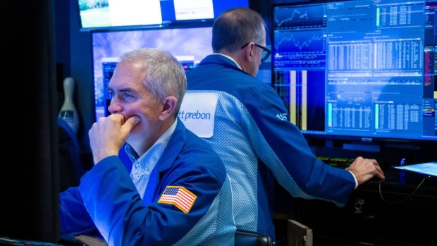 ASX drops despite Wall Street pushing to record ahead of Fed decision