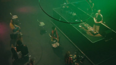 Clubbers party from their chairs. 