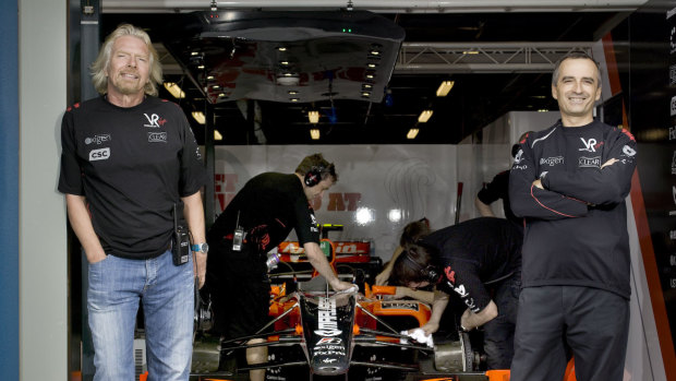 Sir Richard Branson and John Borghetti withthe Virgin Racing Formula One car.