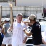 Nine CEO carries Olympic torch as journalists’ strike looms