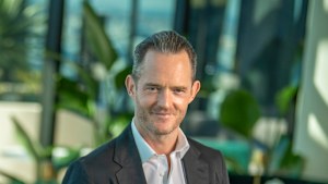Tim Gurner in the rooftop bar of his latest build-to-rent development Madison Grand, set to open on Monday. 