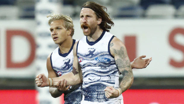Zach Tuohy celebrates a goal during the round 21 match between Geelong and the Greater Western Sydney Giants.