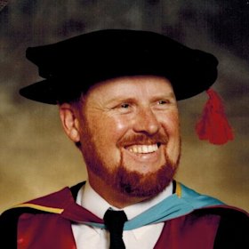 Dr Geoff Crawford graduates.