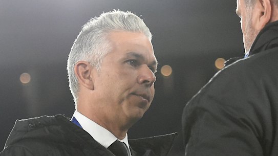 Steve Corica speaks with Ange Postecoglou after Sydney FC's 4-0 defeat to Yokohama F. Marinos.