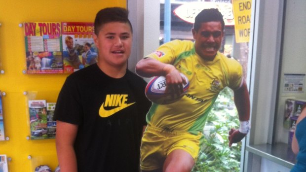A young Josh Schuster with a cardboard cut-out of his uncle, Australian Sevens star Peter Schuster.