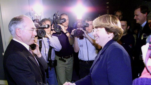 Flashback to 1999: Then-prime minister John Howard and Democrats leader Meg Lees reach a deal on the GST.