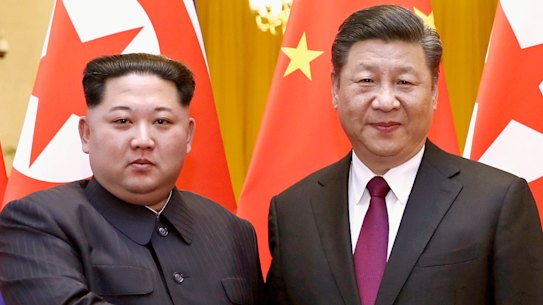 North Korean leader Kim Jong Un, left, and Chinese President Xi Jinping shake hands in Beijing in 2018.