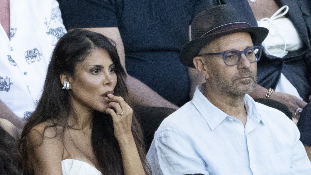 Alex Waislitz in a black fedora with fiance Rebekah Behbahani, at left, at the Australian Open men’s final.