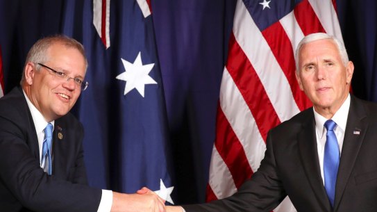 Australian Prime Minster Scott Morrison, left, and U.S. Vice President Mike Pence shake hands during a bilateral meeting on the sidelines of the APEC Summit in Port Moresby, Papua New Guinea, Saturday, Nov. 17, 2018. (AP Photo/Mark Schiefelbein, Pool)