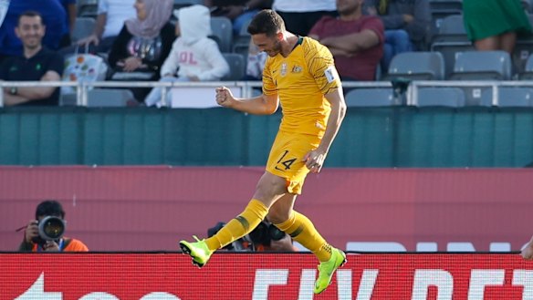 Happy days: Apostolos Giannou celebrates after scoring Australia's third goal against Palestine.
