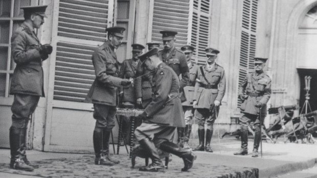 King George V knights Sir John Monash at the Australian Corps headquarters in France, 1918.