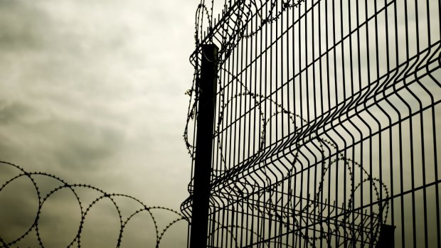 Nine prison officers were hospitalised with smoke inhalation after a cell fire on the weekend.