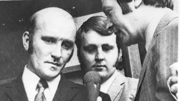 Then senior detective Brian Murphy, left, and constable Karl Stillman, centre, in March 1972, after a Melbourne court acquitted them over the death in custody of Neil Collingburn.