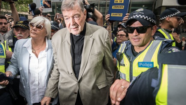 Cardinal George Pell leaving the County Court where was found guilty of historic sexual offenses.