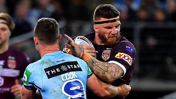Controversial figure: Josh McGuire charges into the Blues during the Origin decider.