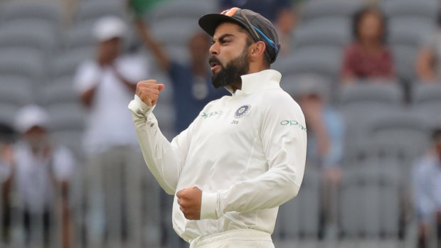 Rolling with the punches: Virat Kohli led the Indian fightback.