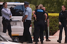 A body reportedly found in a bin outside a Brisbane apartment complex has been described as “pretty disturbing” by a witness, as police investigate the death.