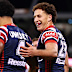 Mark Nawaqanitawase of the Roosters celebrates scoring a try.