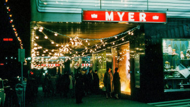 Shoppers in the 1950s admire the Myer Christmas windows.