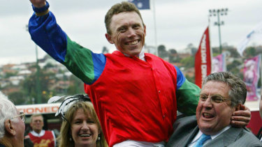 Dream: Whitby celebrates with jockey Chris Munce after winning the 2004 Cox Plate with Savabeel. 