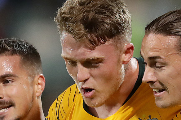 Goal-scorer Harry Souter, centre, with Socceroo teammates in 2019.